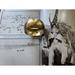 Vintage gold bangle with engraved elephants